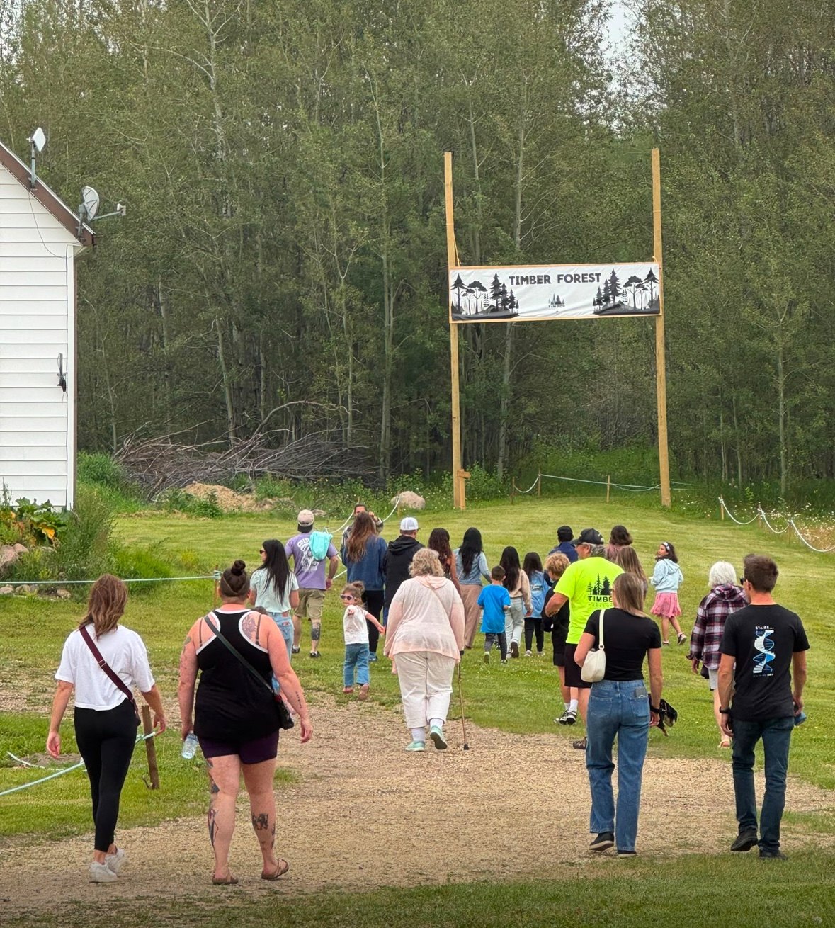 Families and children walking toward the Timber Forest entrance during Timber Festival 2026